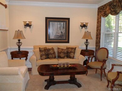 Formal living room w/hardwood floors, upgraded lig