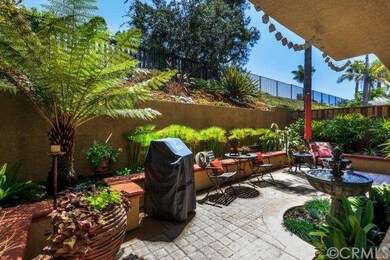 The backyard featuring lush tropical landscaping w