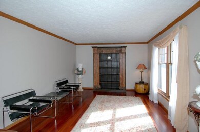 The formal living room features a large double win
