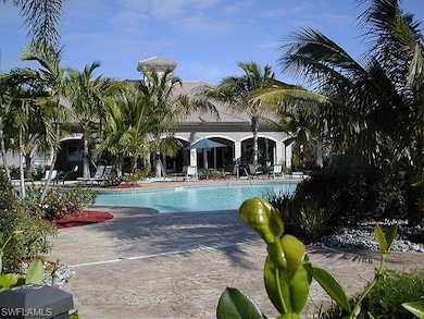 Community pool featuring a patio area