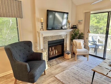 Sitting room featuring a premium fireplace, wood f