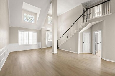 Foyer entrance featuring ornamental molding, stair