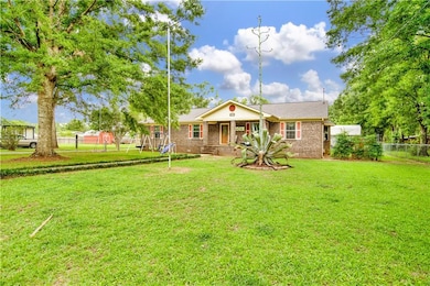 Ranch-style house with brick siding and a shingled roof