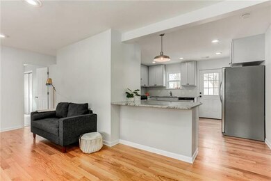 View of the living/dining space to the kitchen.