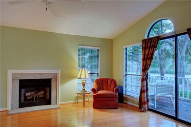 Wood burning fireplace in the living room with vie