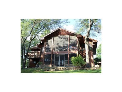 Back of Home with 2 Screened Porch & Deck with Built-In Bench!