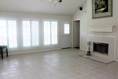 Big open living room with a wall of windows out to