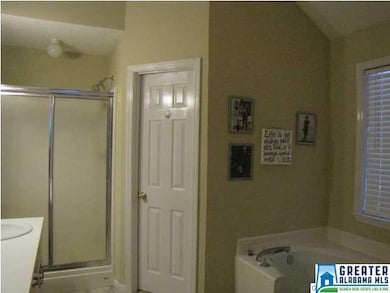 Master bathroom has two large walk-in closets, gar