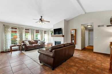 The great room enjoys the wooded views thanks to t