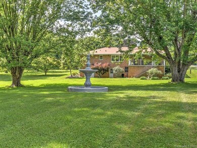 Property line is in between trees and fountain...