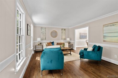 Hardwood floored living room featuring ornamental
