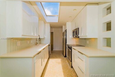 Updated gloss white cabinetry and SS Appliances.