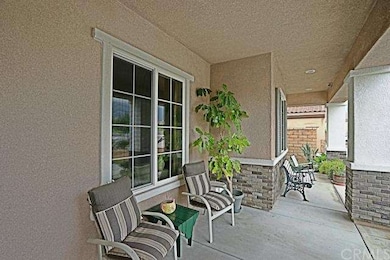 RELAXING FRONT PORCH WITH A VIEW OF LEGACY PARK