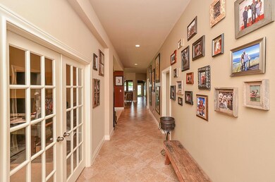 Tiled Entry with French doors leading to study