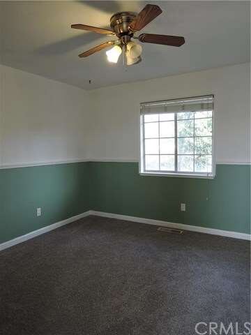 First bedroom with new carpet, fresh paint and ven