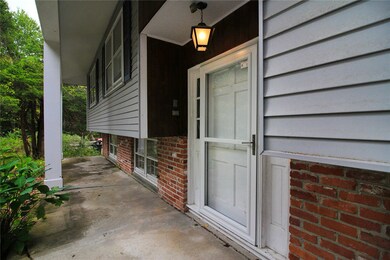 Vinyl siding with brick accent.