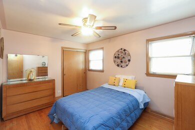 This is the front bedroom, hardwood floors and cei