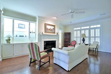 Living Room with Lighted Display Cabinets and Gas