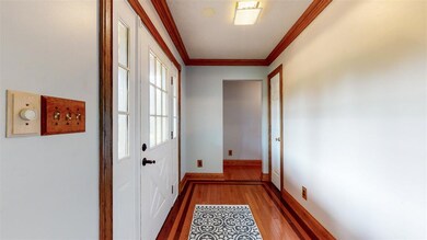 Bright Entry foyer provides coat closet to Welcome