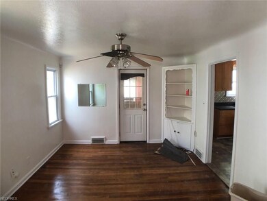 Formal dining room with hardwood floors and built 