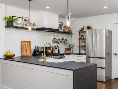 Kitchen featuring appliances with stainless steel