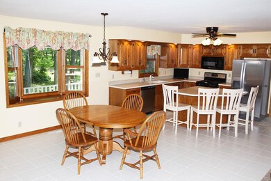 The large eat-in area with tile floors and a bay w