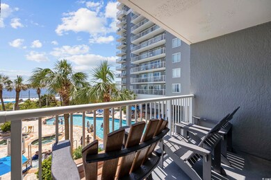 Balcony featuring a community pool