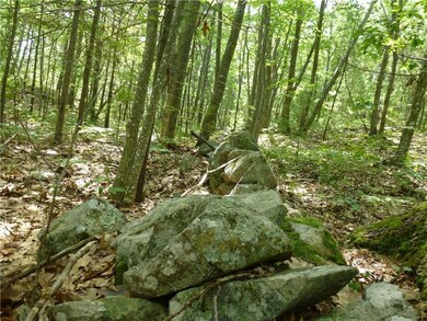Property bordered by stone wall on...