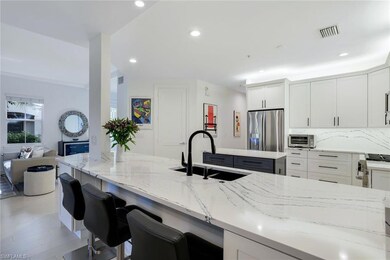 Kitchen with white cabinets, stainless steel refri
