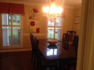 large windows, plantation shutters, wood floors, c