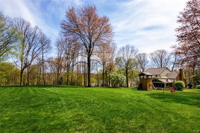 Gorgeous one acre setting with mature trees!