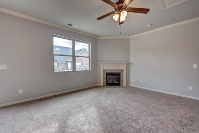 Great room with view to back yard.  All photos are of a similar home, not of actual property listed