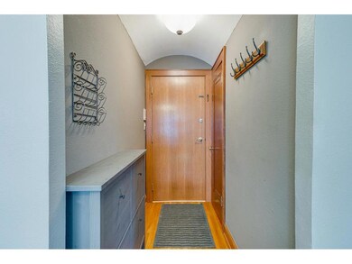Entryway with beautiful hardwood floors, a spaciou