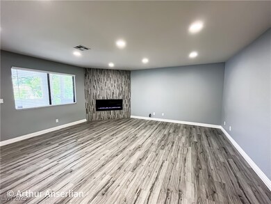 living room featuring recessed lighting, visible v