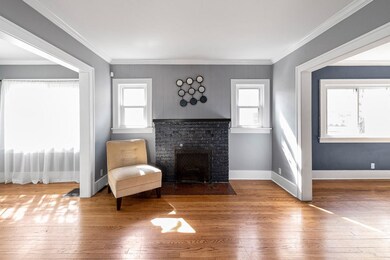 Living room opens to little front den/sunroom and 