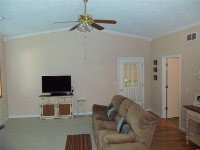 Great room has vaulted ceiling & gas fireplace.