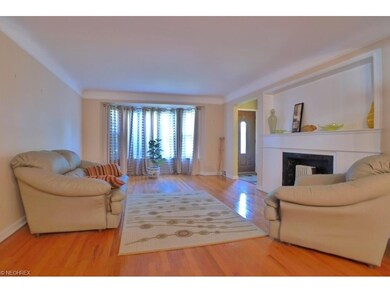 A very generous sized living room with bay window 