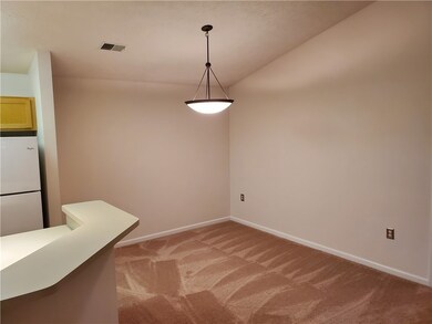 Dining room with upgraded pendant light and cathed
