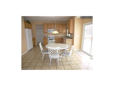 Kitchen with eating area and ample cabinet space