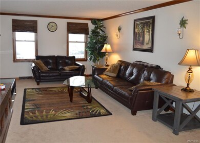 Living room with natural tones and newer carpet