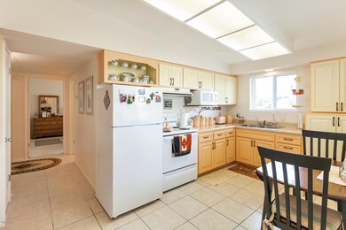 Kitchen is light and open. Cuboards are