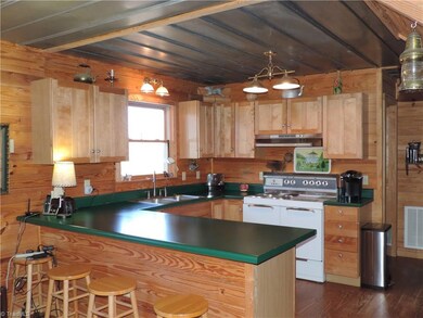Charming old kitchen with decorative period lighting.