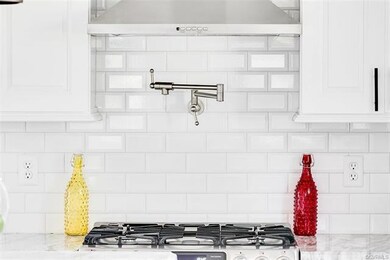 Xtreme Homes thinks of the modern conveniences.  A stainless steel pot-filler is perfect for those large pots!