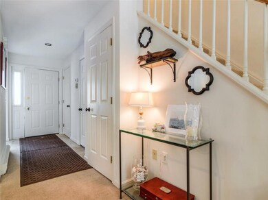Inviting front entryway with coat...