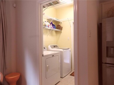 Utility Room, Washer & Dryer Remain.  Door to Patio is here.