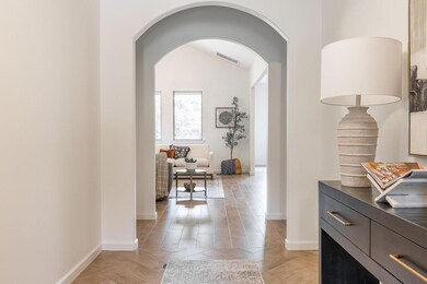 Living room featuring wood-type flooring, a firepl