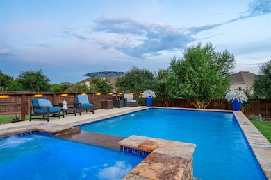 View of pool with a fenced backyard