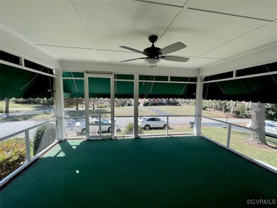 Unfurnished screened porch with a ceiling fan