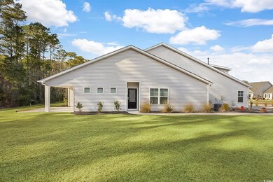 Rear view of property featuring a yard