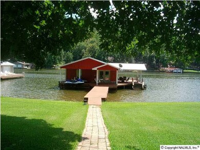 View of boat house with paved walk.